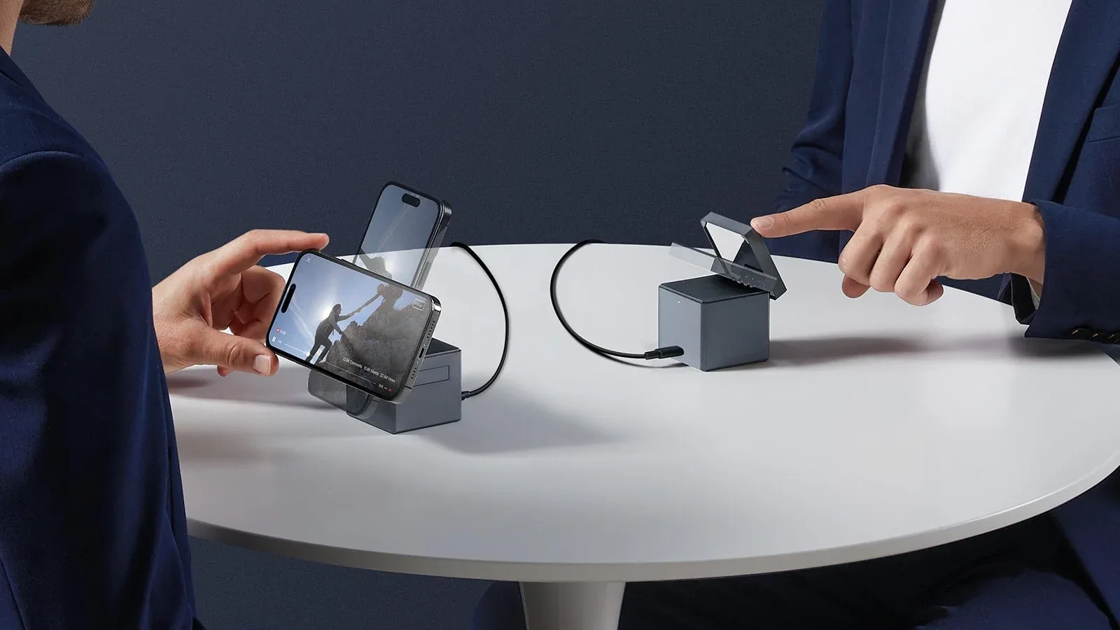 Anker 3-in-1 Cube with MagSafe with its phone mount lifted and rotated to landscape on a table