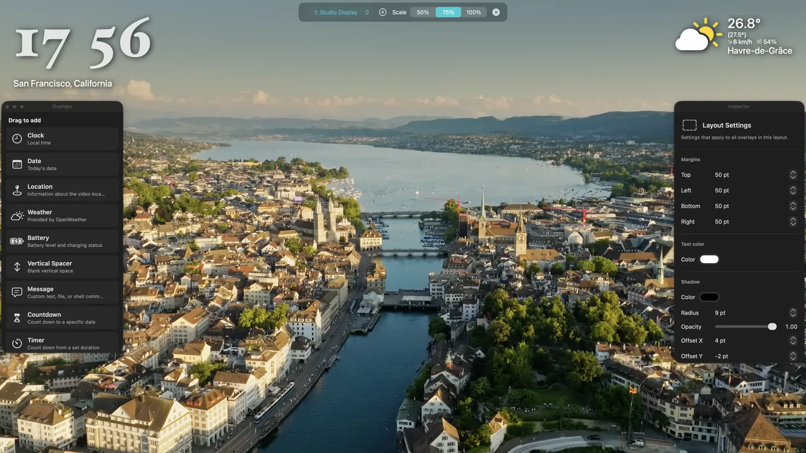 Aerial overlay editor with a clock, weather, and location over an aerial city video