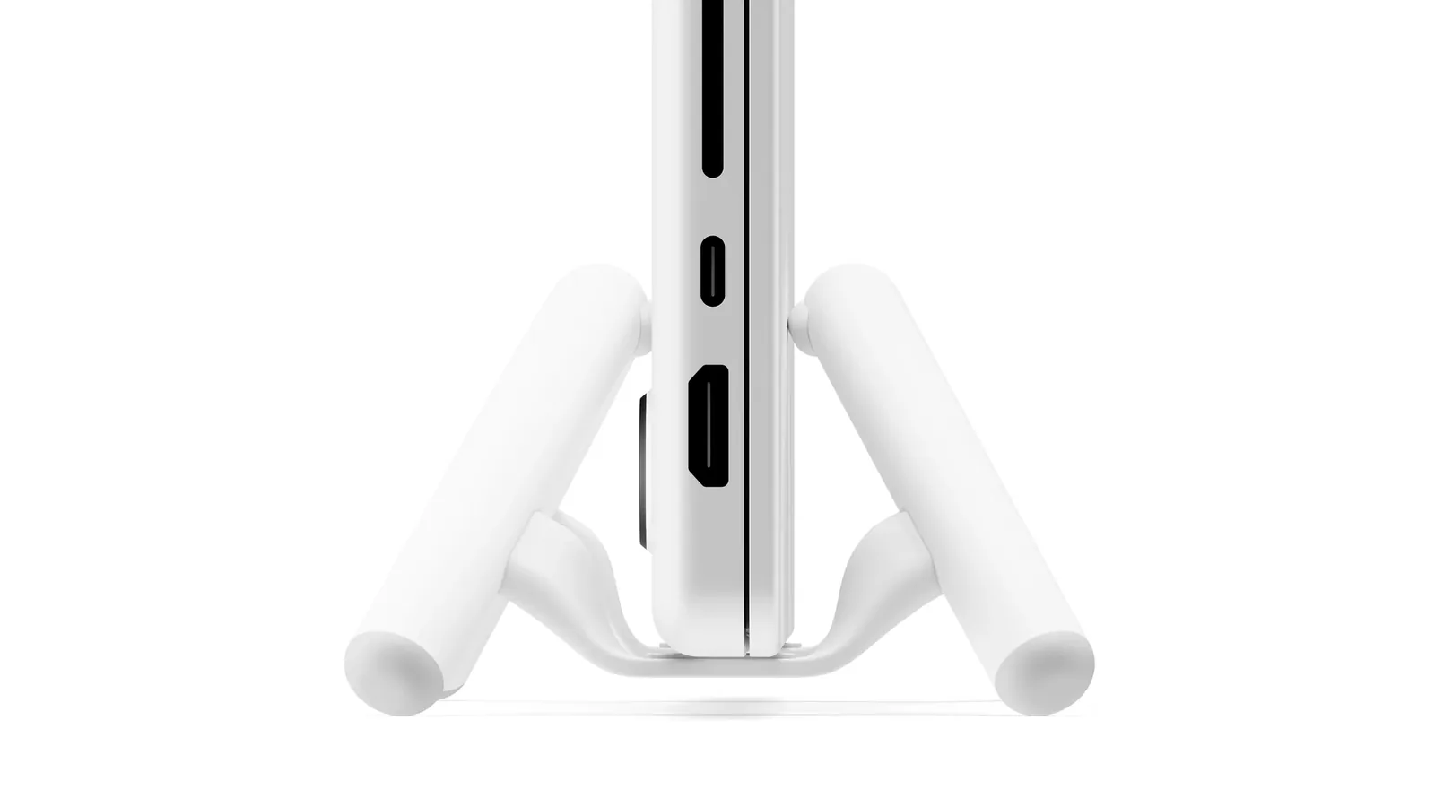 Close-up of the BookArc Flex arcs gripping the edge of a closed MacBook with its ports visible